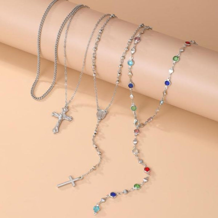 Chic women's layered cross necklace set in gold & silver tones, a versatile and trending fashion jewelry accessory.