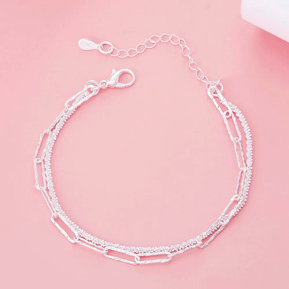 Women's 925 Sterling Silver Double Chain Bracelet. Elegant & adjustable silver jewelry, perfect fashion accessory.
