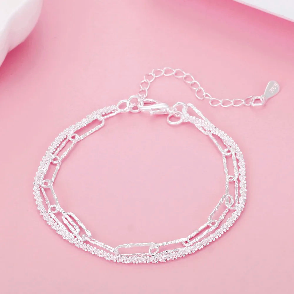 Hypoallergenic 925 sterling silver double chain bracelet for women. Dainty & elegant silver jewelry accessory.