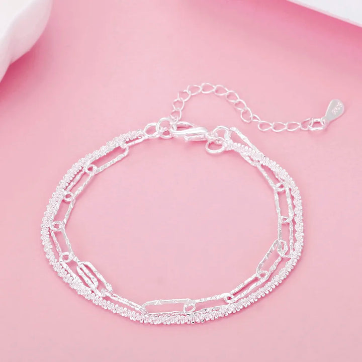 Hypoallergenic 925 sterling silver double chain bracelet for women. Dainty & elegant silver jewelry accessory.