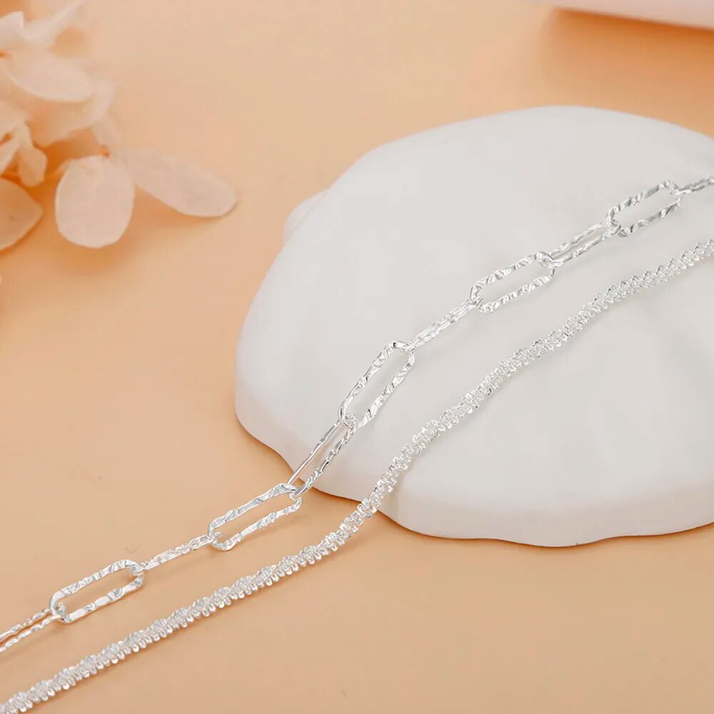 Adjustable 925 sterling silver double chain women's bracelet. Chic silver jewelry, a versatile fashion accessory.