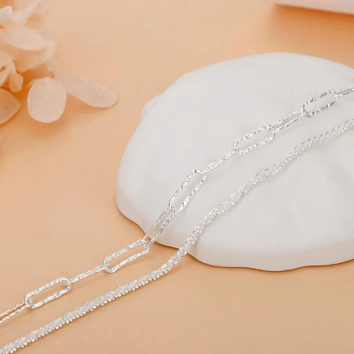 Adjustable 925 sterling silver double chain women's bracelet. Chic silver jewelry, a versatile fashion accessory.
