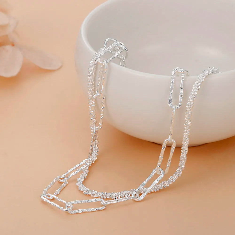 Luxurious 925 sterling silver double chain bracelet for women. Elegant & hypoallergenic silver fashion jewelry.