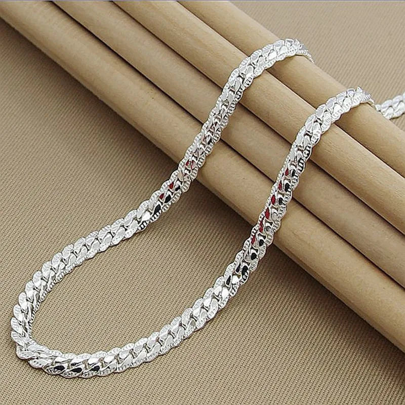 Versatile women's sterling silver lucky charm necklace, an elegant pendant that complements everyday wear & special outfits.