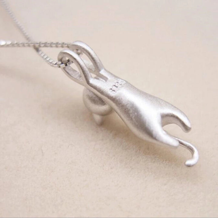 Elegant women's sterling silver playful cat pendant, a cute kitty necklace. Ideal for everyday wear & cat fans.