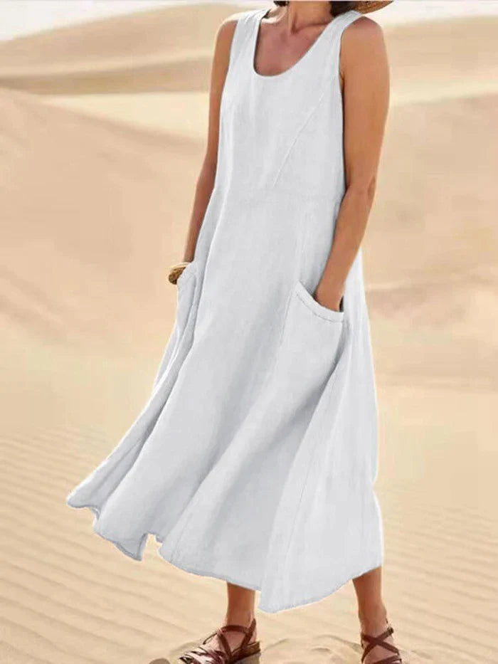 Casual women's A-line summer dress in breathable linen, featuring practical pockets and a relaxed, comfortable fit.