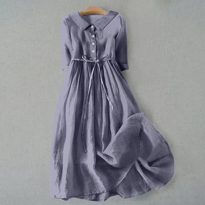 Relaxed fit A-line midi dress with short sleeves for women. Comfortable casual summer fashion.