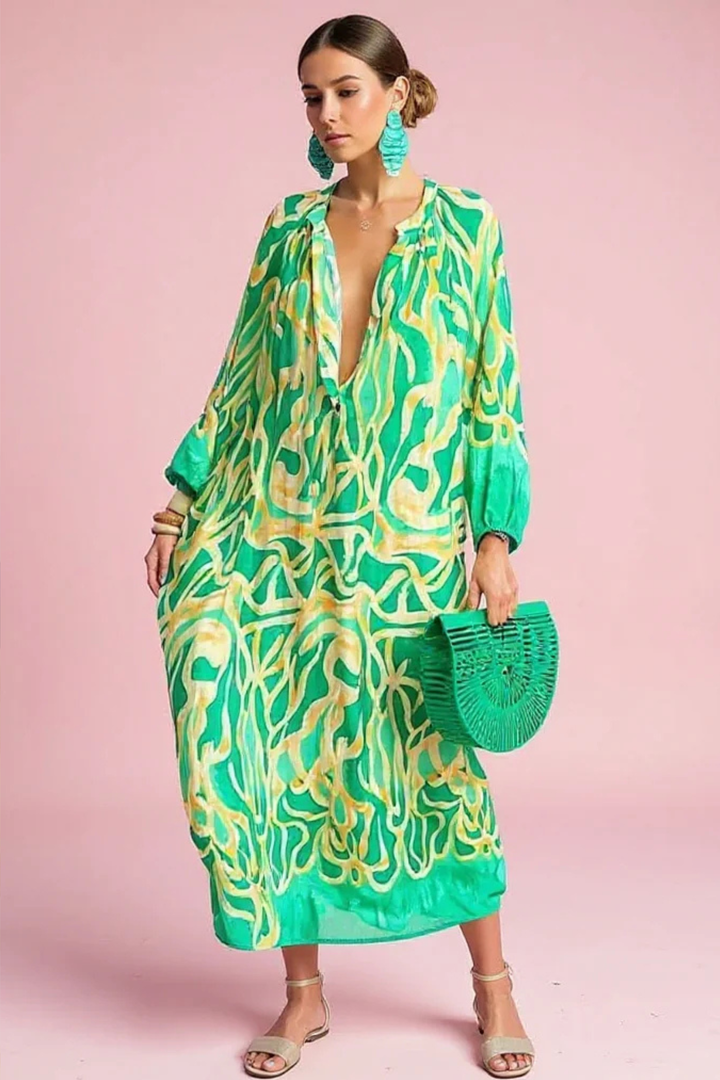Women's abstract print V-neck kaftan maxi dress. Flowy, comfortable resort wear perfect for summer & vacation.