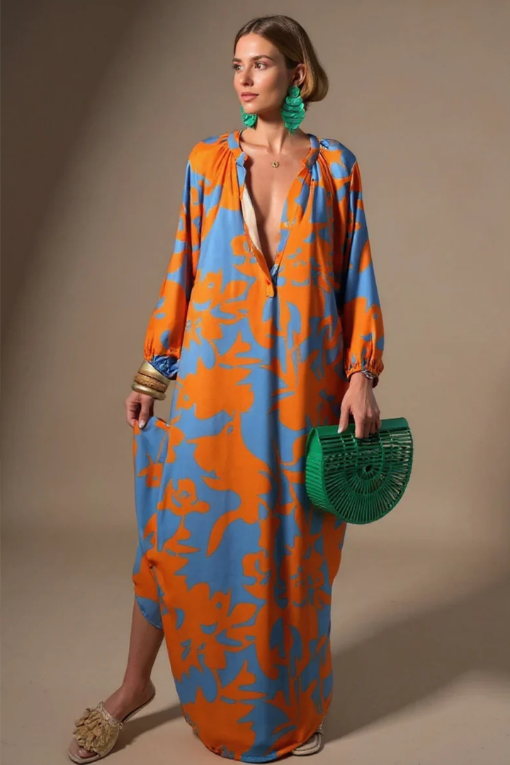 Boho chic women's kaftan maxi dress with a relaxed fit V-neck & vibrant abstract print. Great for summer.
