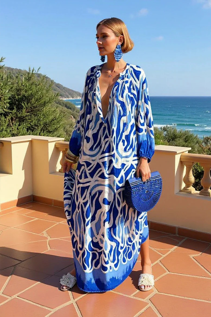 Stylish abstract print kaftan maxi dress, ideal resort wear or beach cover up. Flowy V-neck for vacation style.