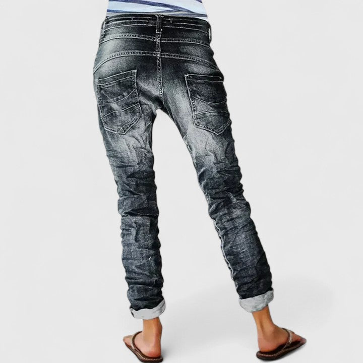 Women's acid wash skinny jeans with white contrast stitching & button fly for vintage casual style.
