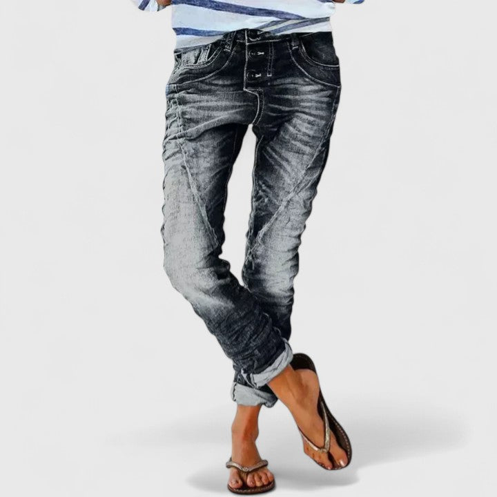 Comfortable women's acid wash skinny jeans with a tapered leg, contrast stitching & durable button fly closure.