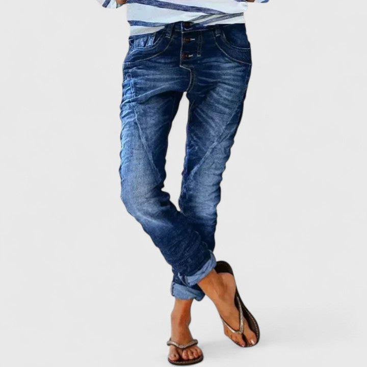 Fashionable women's acid wash skinny jeans, button fly, unique contrast stitch, perfect for a vintage casual look.