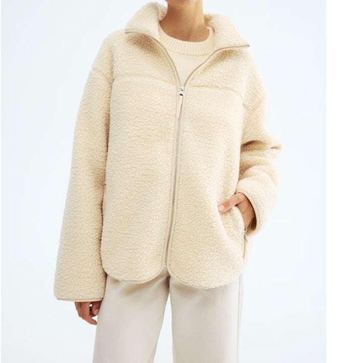 Women's versatile plush jacket, transitions from pregnancy to babywearing and regular wear.