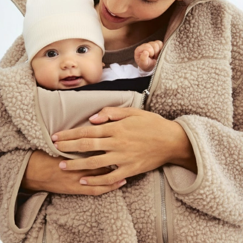 Gray women's plush maternity jacket, comfortable and adaptive, ideal for pregnancy and growing bumps.