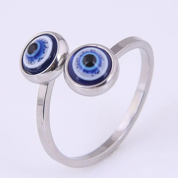 Women's adjustable evil eye ring in gold plated sterling silver, offering symbolic protection & chic everyday wear.
