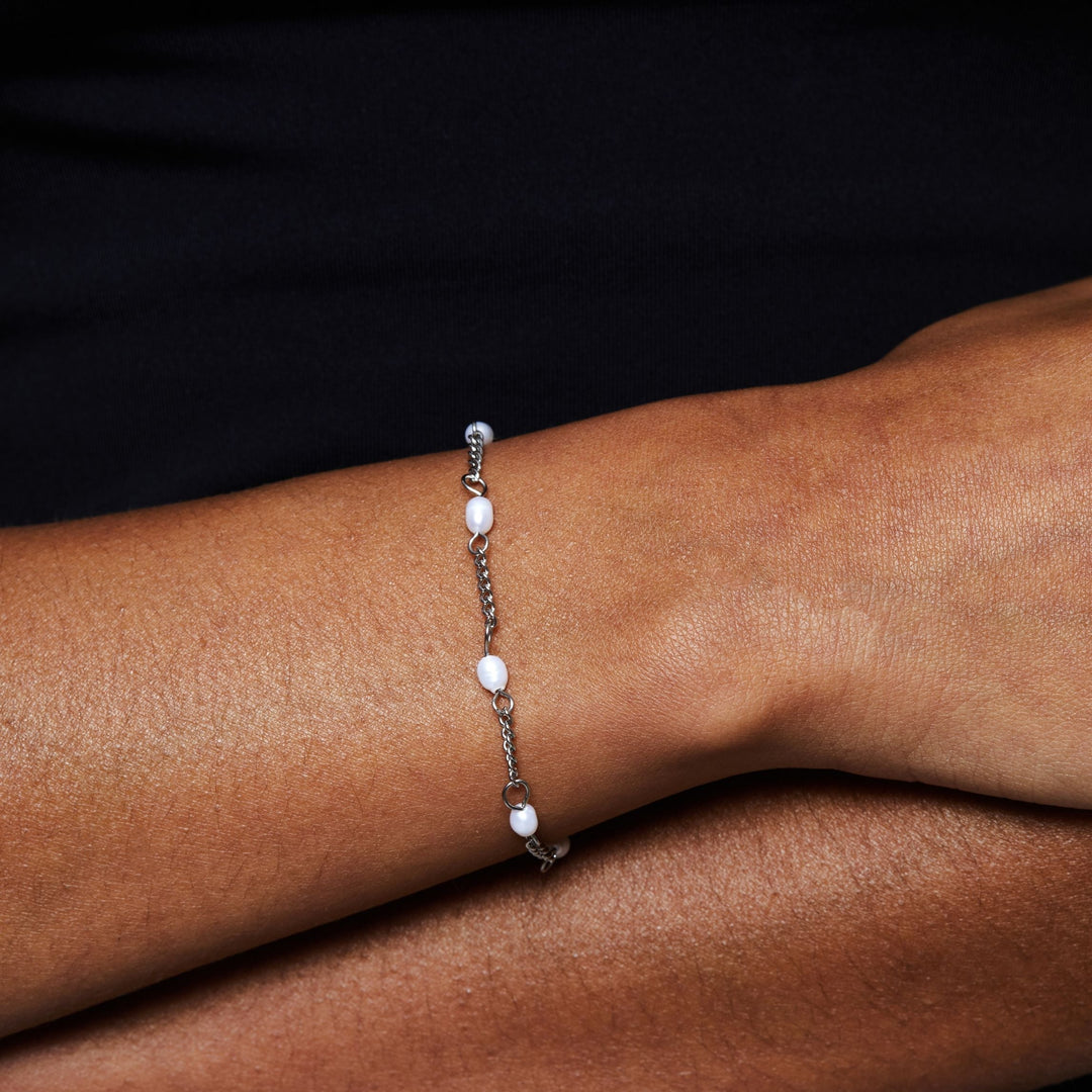 Versatile silver adjustable freshwater pearl bracelet, enhances any women's ensemble.