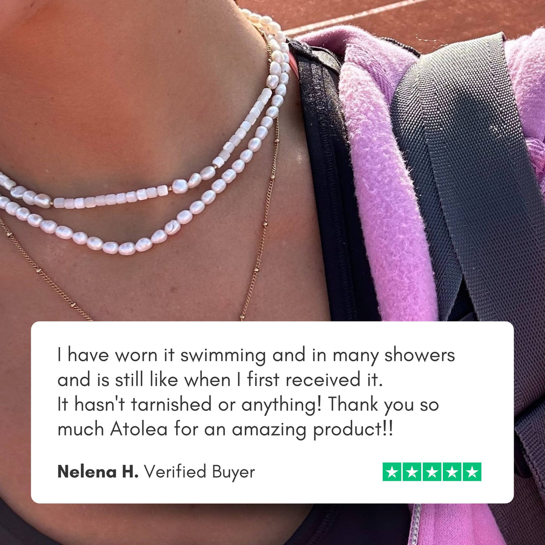 Shimmering freshwater pearl choker necklace, adjustable for women, delicate gold jewelry, elegant design.