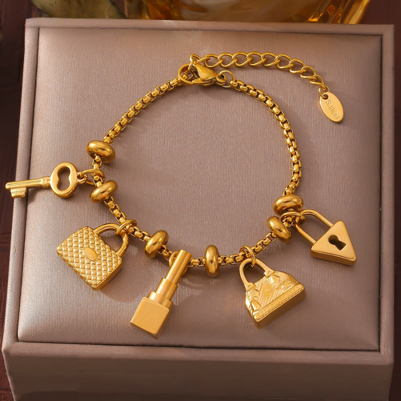 Women's adjustable gold & silver charm bracelet with sparkling rhinestones. Elegant jewelry gift.