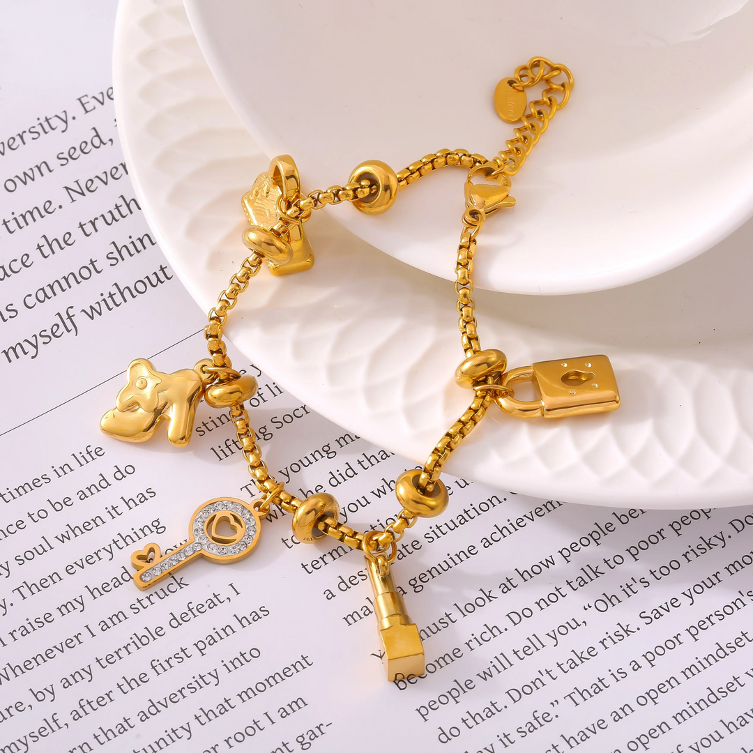 Beautiful gold & silver finish women's adjustable charm bracelet, adorned with sparkling rhinestones.