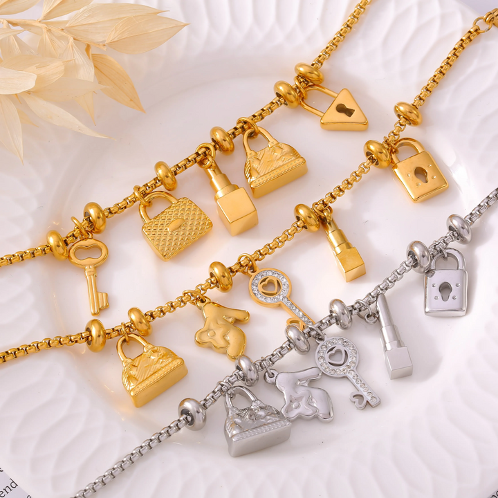 Stackable women's adjustable gold & silver charm bracelet with rhinestones. Elegant jewelry accessory.