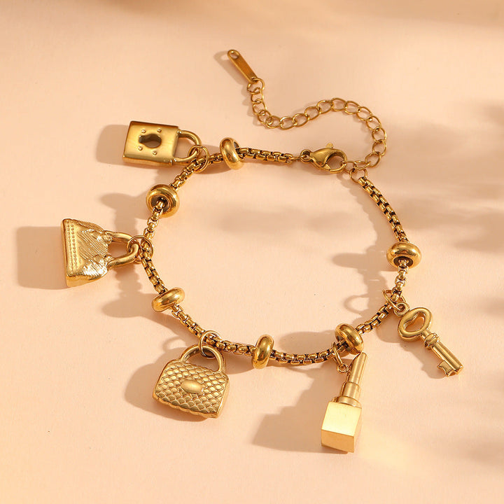 Adjustable women's charm bracelet in gold & silver, perfect fit for any wrist. Elegant rhinestone jewelry.
