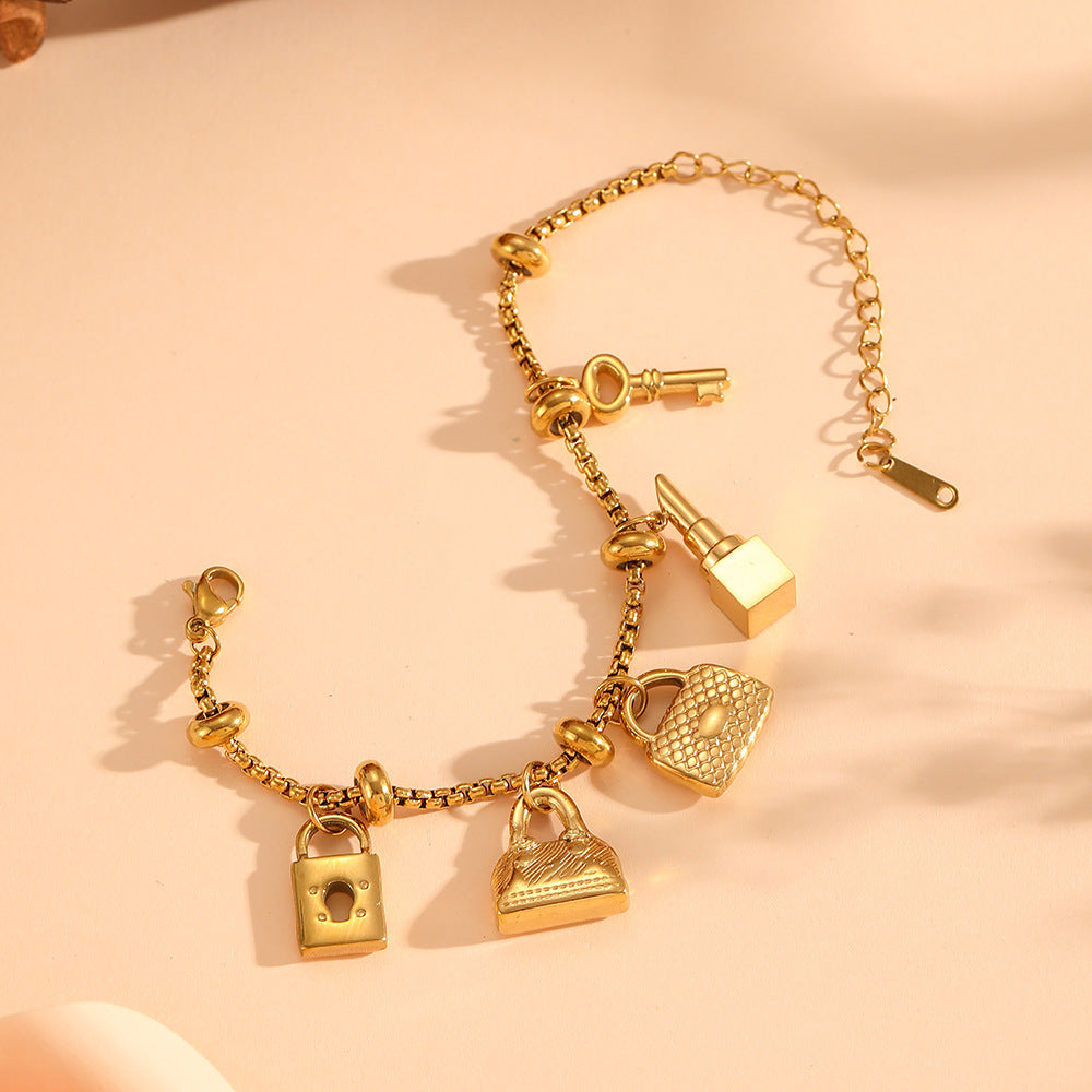 Elegant women's gold & silver adjustable charm bracelet with shimmering rhinestones. Stylish accessory.