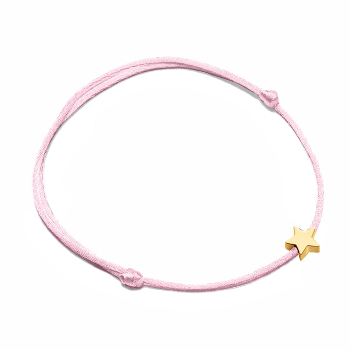 Delicate star charm on an adjustable gold-tone nylon bracelet, perfect for women's fashion.