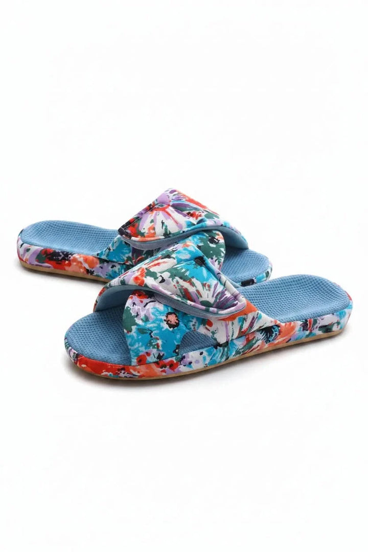 Breathable women's open toe house slippers, featuring an adjustable strap for cozy, casual wear.