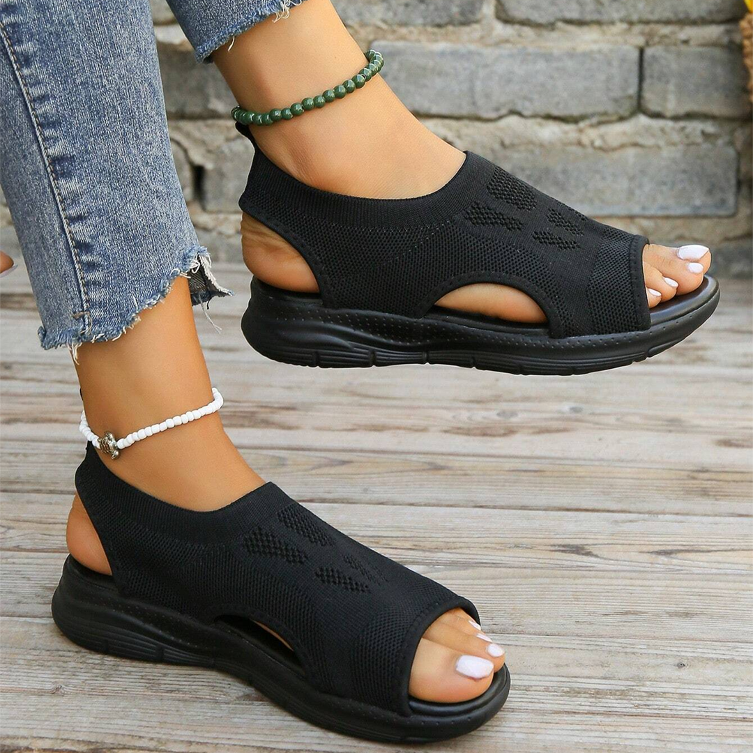Women's adjustable orthopedic walking sandals on a foot, showcasing comfort, support & style.