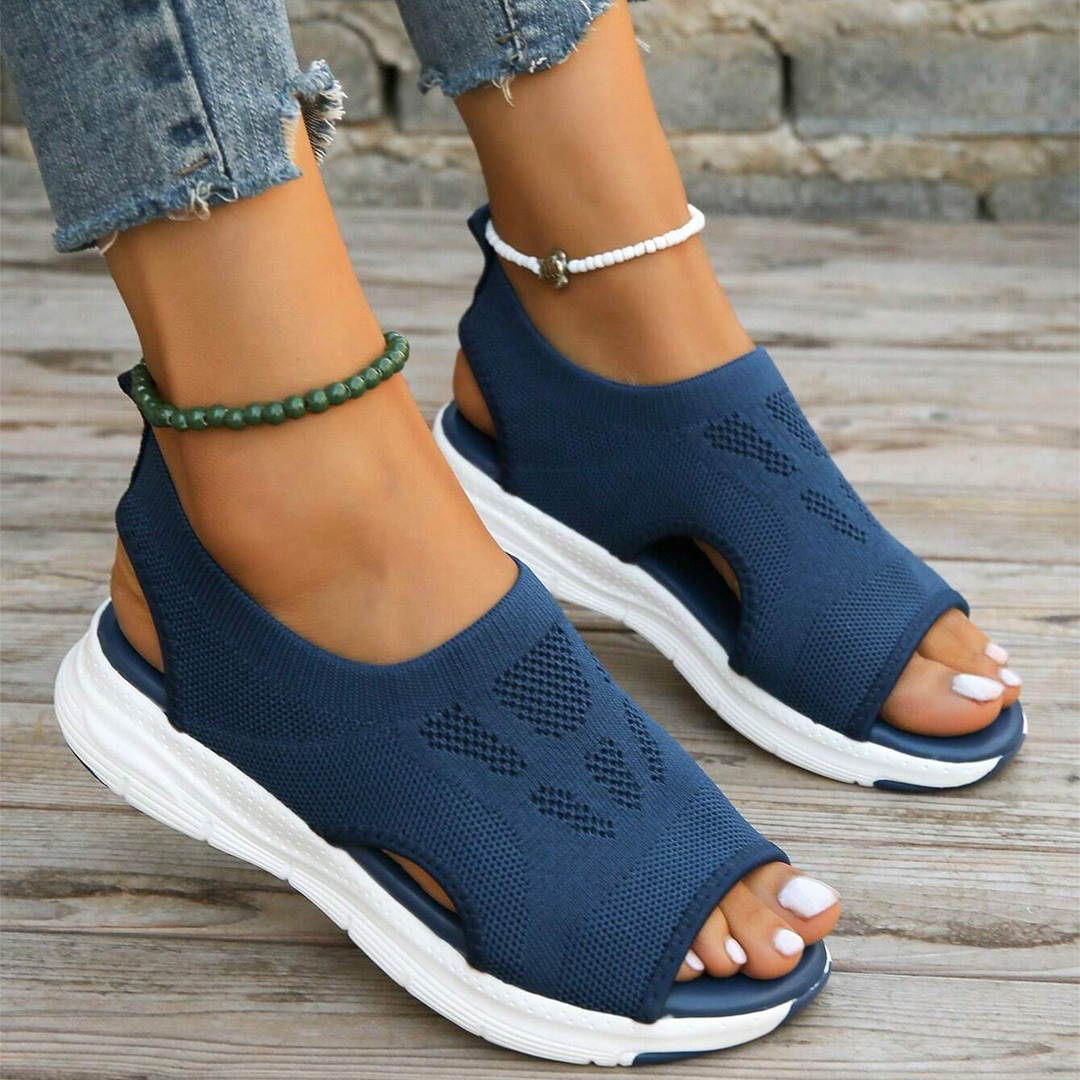 Women's orthopedic walking sandals on a scenic path, ready for comfortable daily wear.