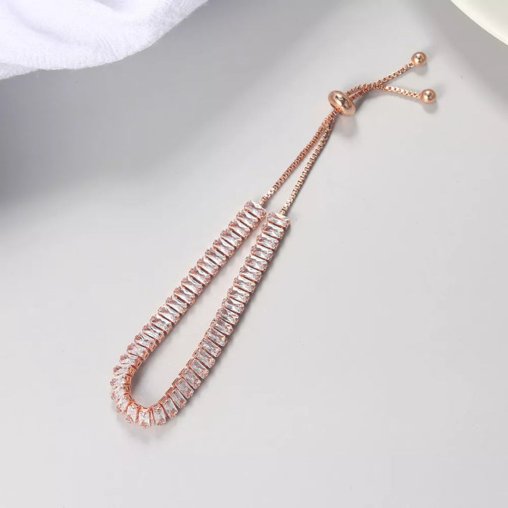 Close-up of an elegant rose gold bracelet for women, featuring adjustable design & sparkling finish.