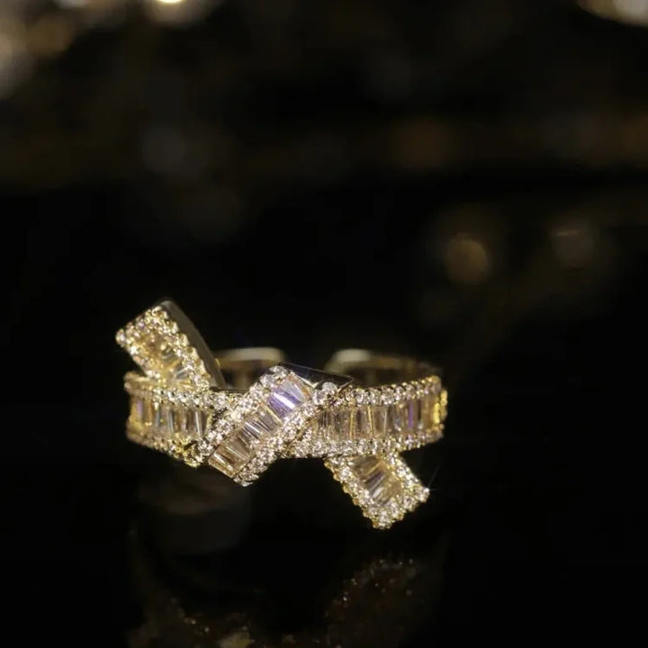 Women's adjustable silver knot ring with sparkling zirconia diamonds. Elegant & stackable fashion jewelry.