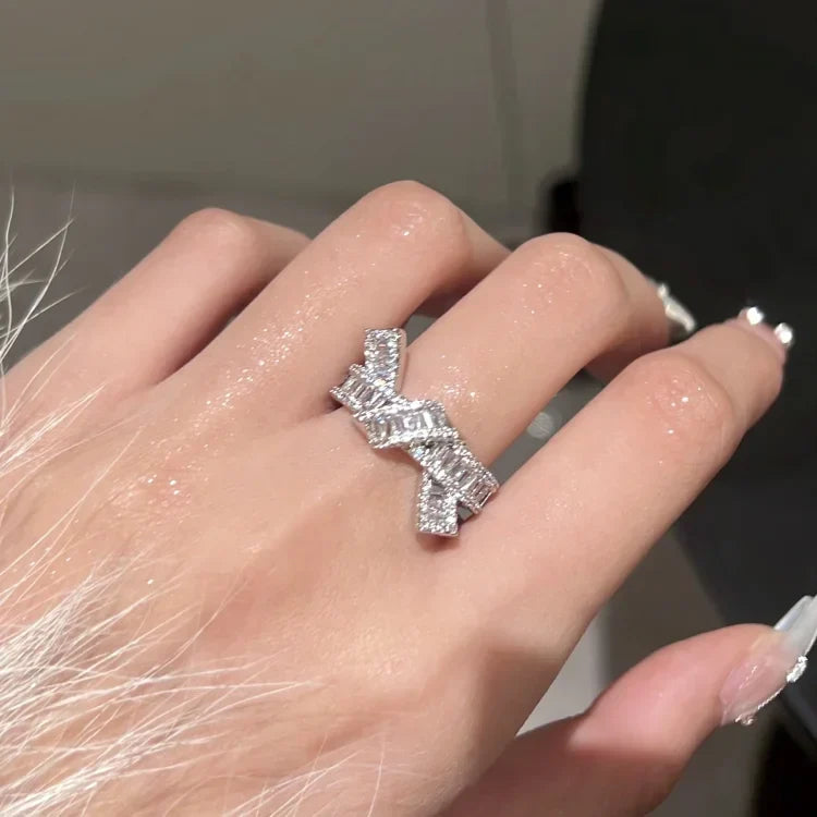 Stylish women's adjustable diamond knot ring, crafted with shimmering zirconia, ideal for everyday elegance.