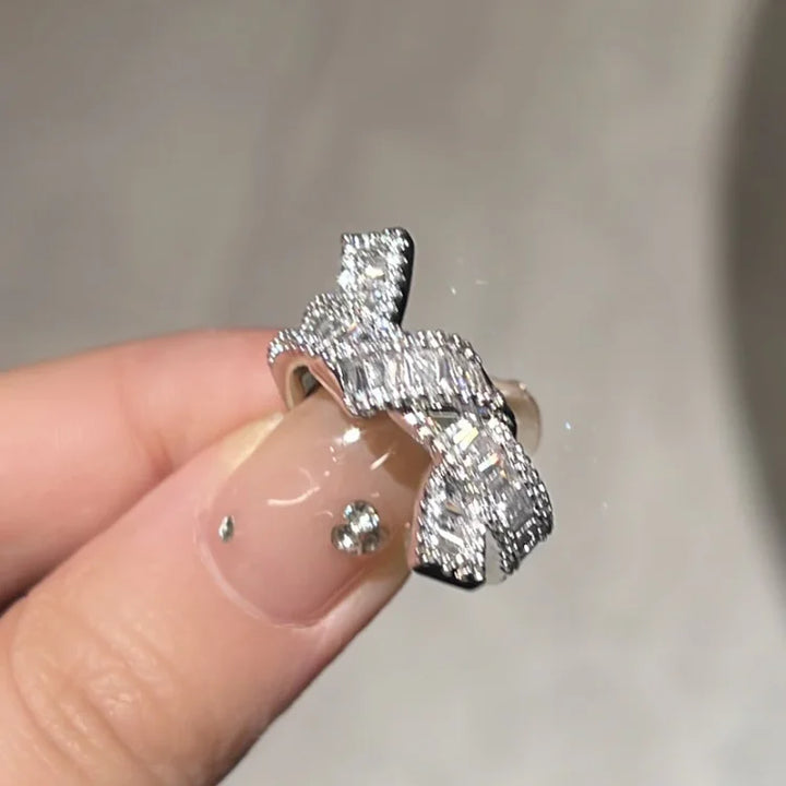 Sparkling adjustable zirconia knot ring, a versatile & stackable diamond-look ring for women.