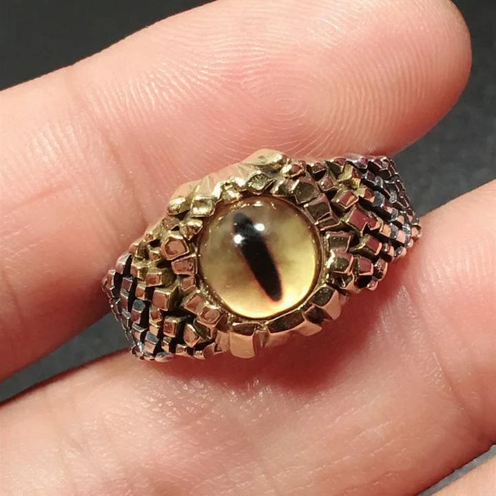 Close-up of a detailed snake ring featuring an eerie demon eye, an adjustable statement piece for women.