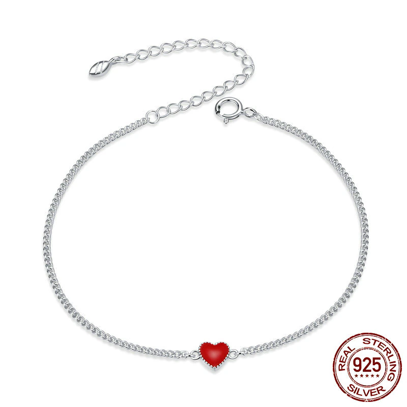 Women's adjustable sterling silver charm bracelet with a vibrant red heart, perfect for everyday elegance.