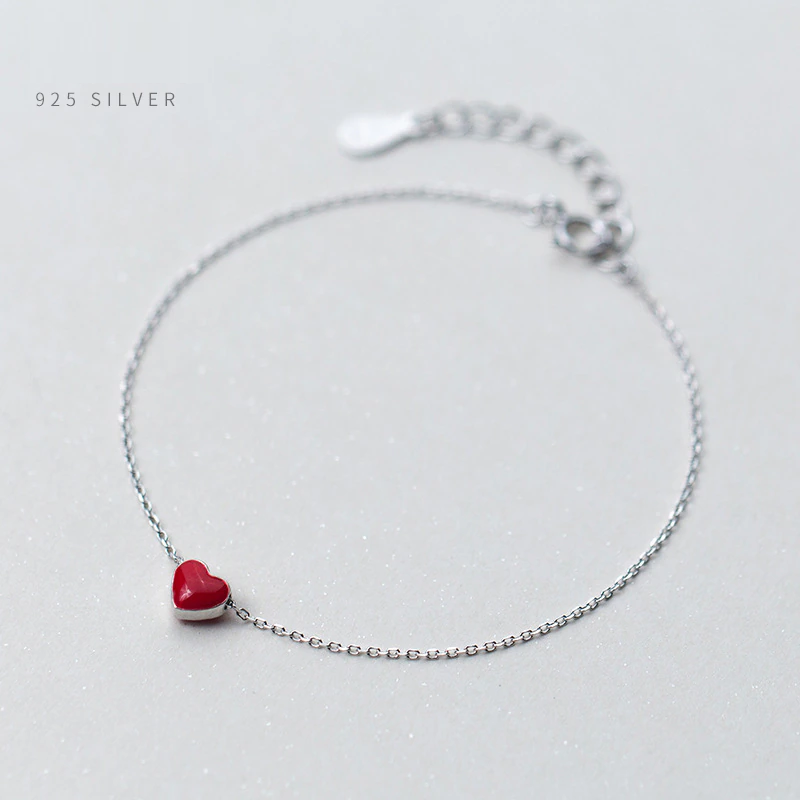 Elegant 925 sterling silver adjustable bracelet for women, featuring a beautiful red heart charm.