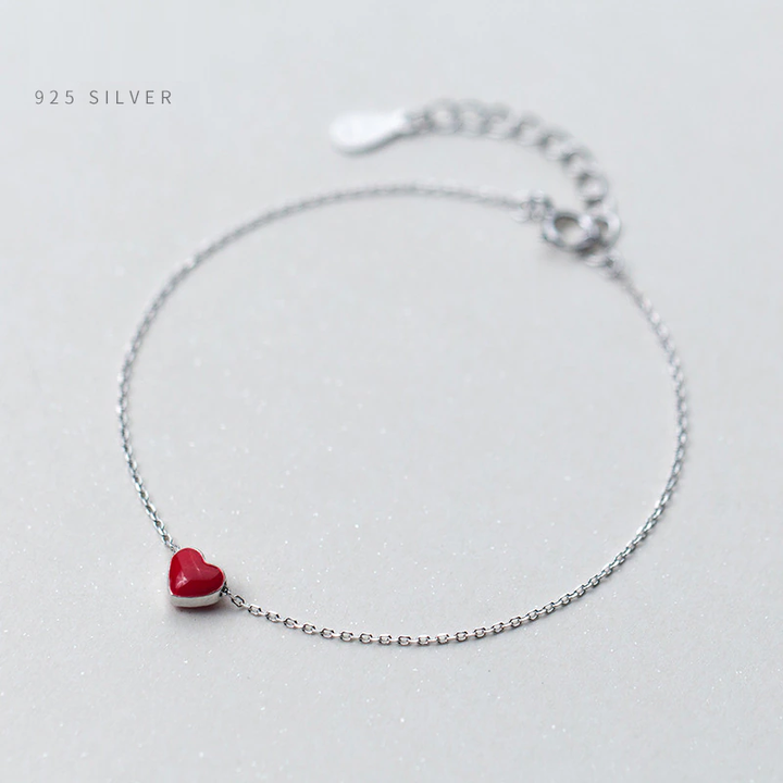 Elegant 925 sterling silver adjustable bracelet for women, featuring a beautiful red heart charm.