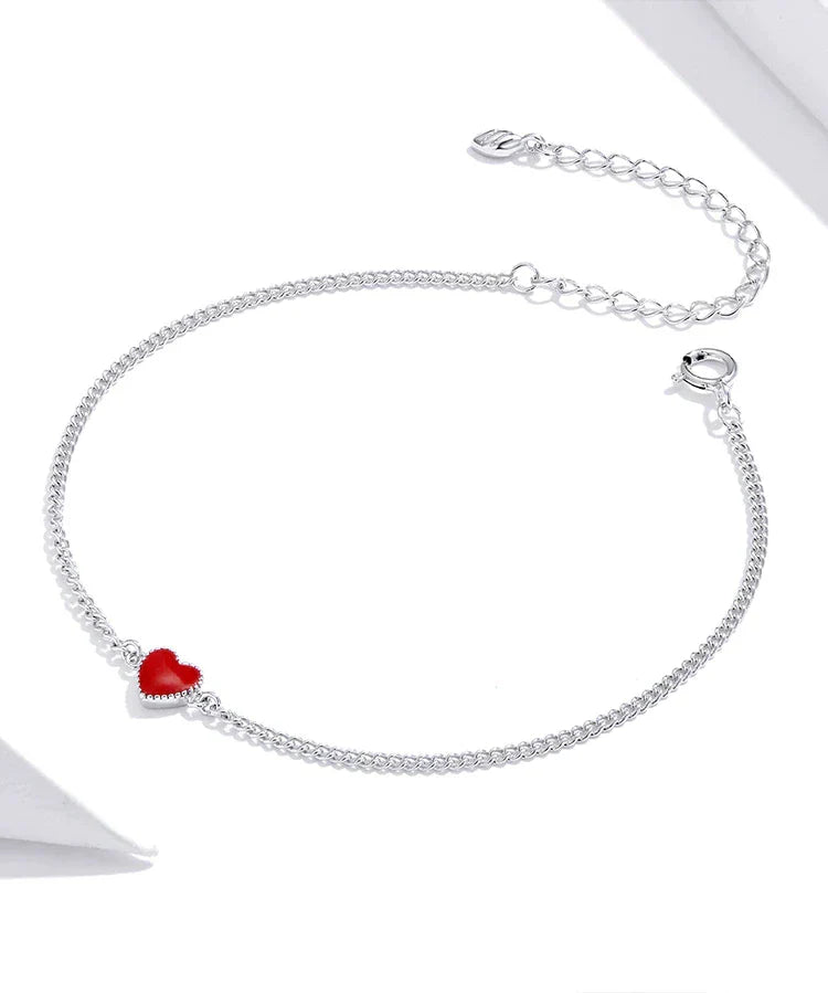 Romantic women's sterling silver charm bracelet with an adjustable chain & a striking red heart. Ideal gift.
