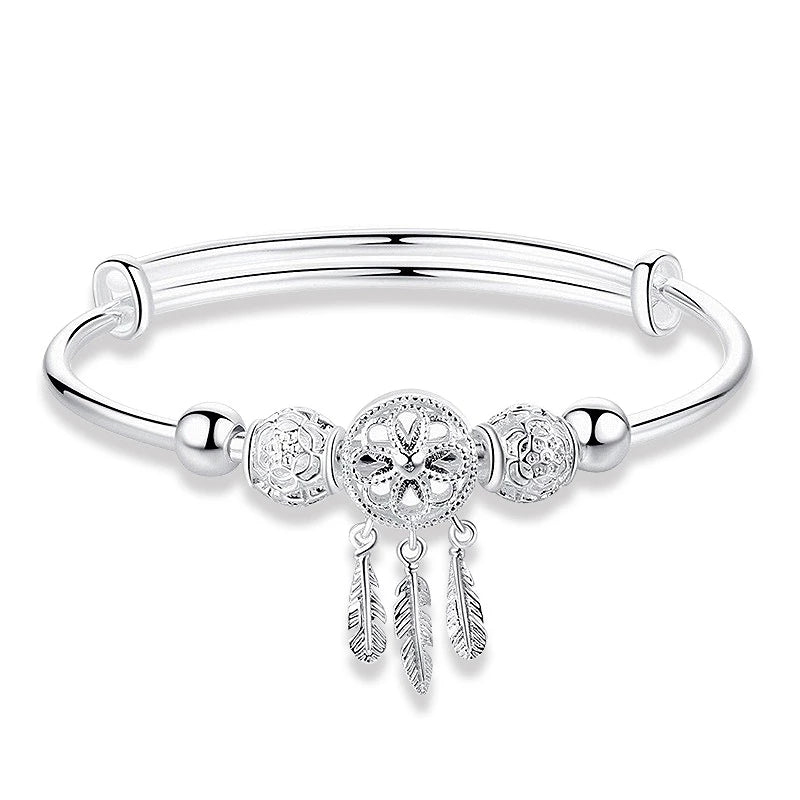 Women's adjustable sterling silver dreamcatcher bracelet, symbolic fine jewelry with intricate detail.