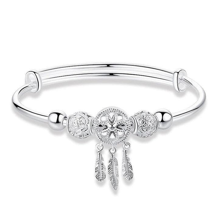 Women's adjustable sterling silver dreamcatcher bracelet, symbolic fine jewelry with intricate detail.