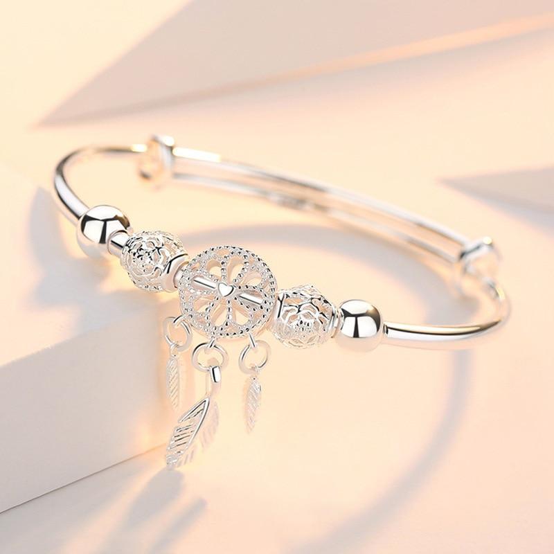 Handcrafted 925 sterling silver adjustable dreamcatcher bracelet for women, elegant and symbolic jewelry.