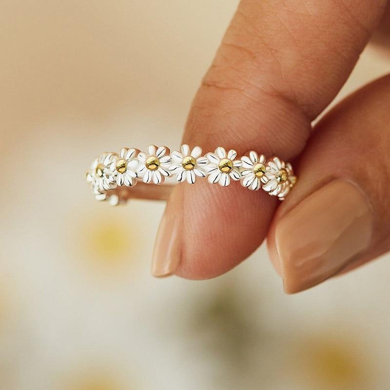 Close-up of a women's adjustable silver daisy ring, showcasing intricate floral design, perfect as a unique gift.