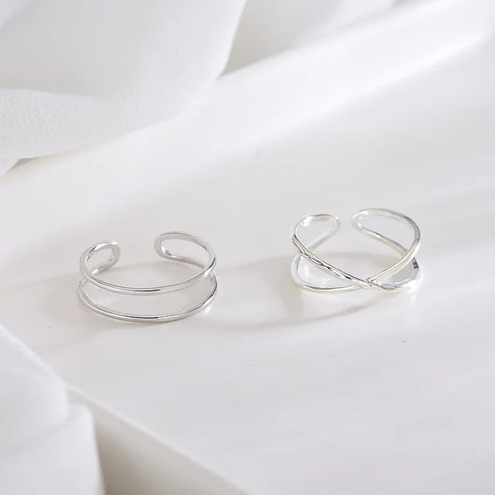 Minimalist women's adjustable sterling silver double line ring, ideal for stacking or solo wear.