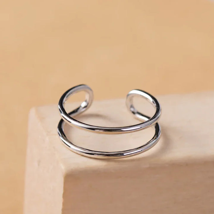 Elegant women's adjustable double line sterling silver ring, a sleek and modern addition to any jewelry collection.