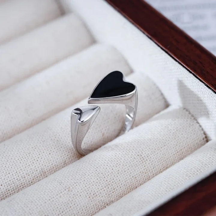Fashionable adjustable women's ring, featuring a stylish symmetrical heart in sterling silver.