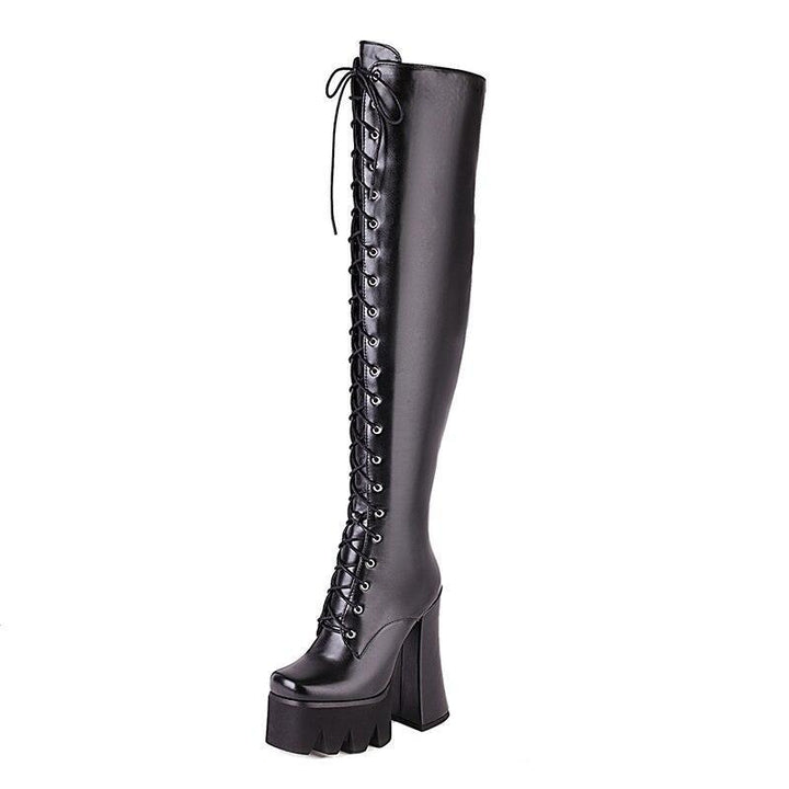 Women's Adora platform knee-high boots, perfect for an edgy, fashion-forward look. High heel, sleek design.