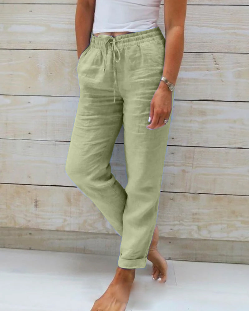 Side view of women's airy summer pants, highlighting the comfy elastic waist and loose, casual fit.