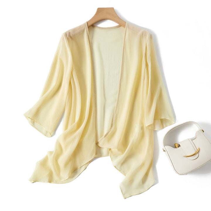 White Alena lightweight cardigan. Elegant long sleeve cover-up for women's fashion layering.